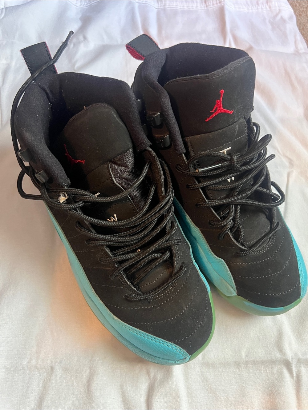 Jordan High-Top Sneakers in Black with Teal & Green Accents
